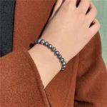 accessoire perle noire élastique