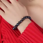 Bracelet avec perles noires 9-10 mm
