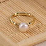 bague dorée ajustable perle
