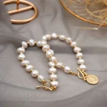 bracelet perle d'eau douce blanche 7-8 mm couleur or