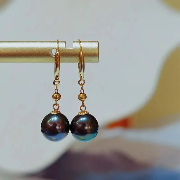 Boucles d'oreilles pendantes en or avec perles de Tahiti